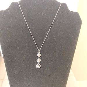 Silver 18 inch length necklace with three tier rhinestone pendant